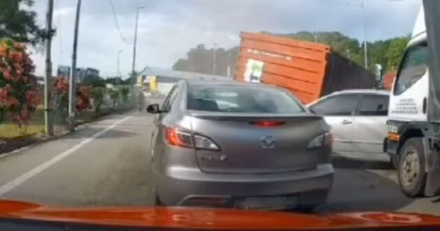 Container falls from lorry in Bukit Mertajam, Penang; one dead, one injured, several vehicles damaged